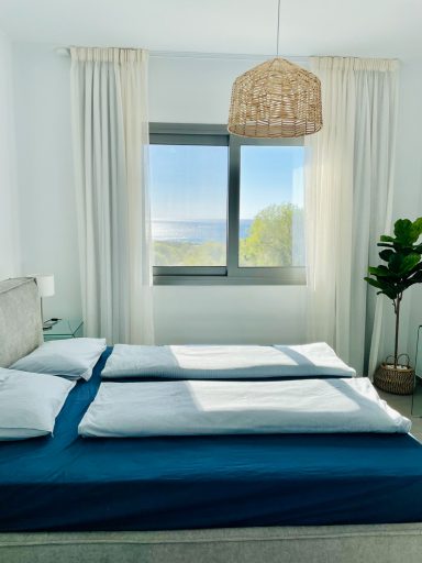 Even from the cozy double bed, you can enjoy a fantastic view of the sparkling ocean.